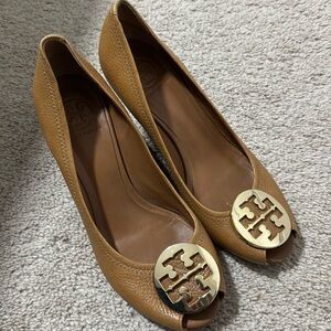 Tory Burch tan sandals with gold hardware.